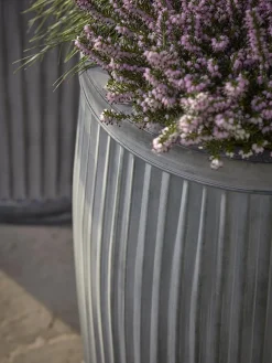 Two zinc Barrel Planters