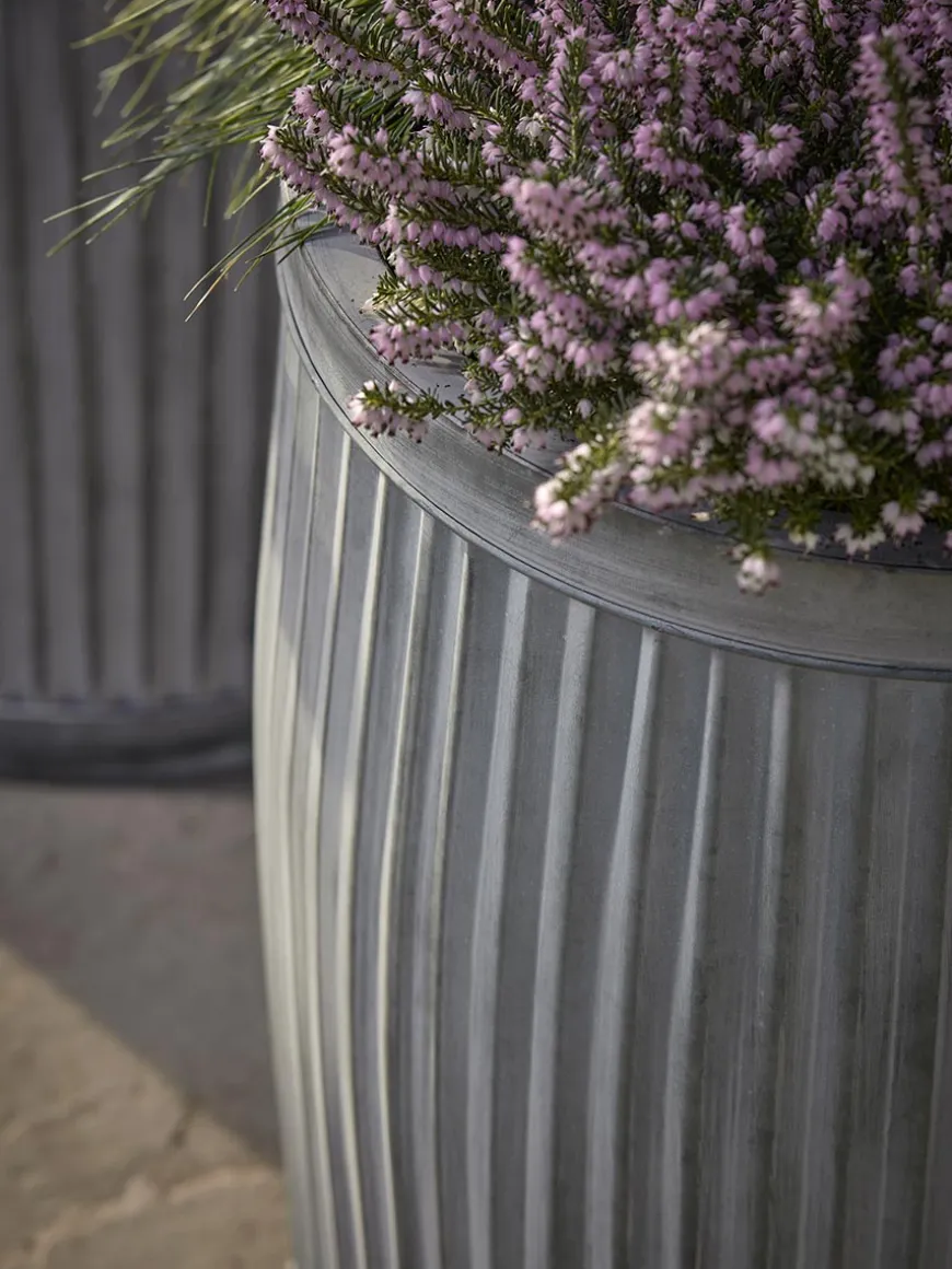 Two zinc Barrel Planters